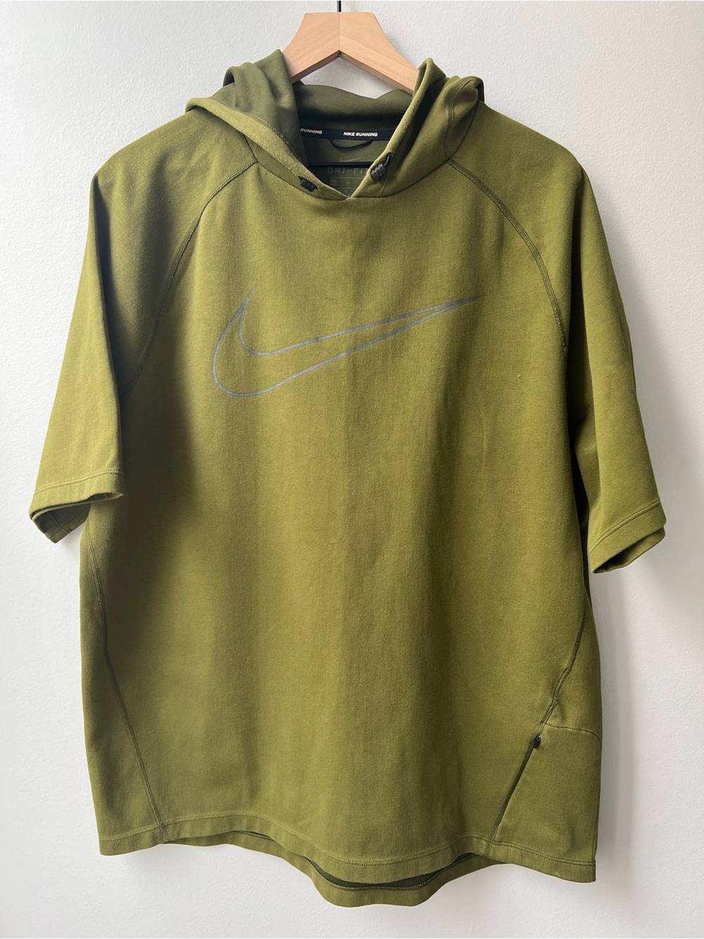 This is a green Nike Dri-FIT short-sleeve hoodie.